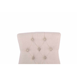 Elegant polstret spisestol med stof og dekorative syninger og fire gummitræben