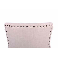 Elegant polstret spisestol med stof og dekorative syninger og fire gummitræben