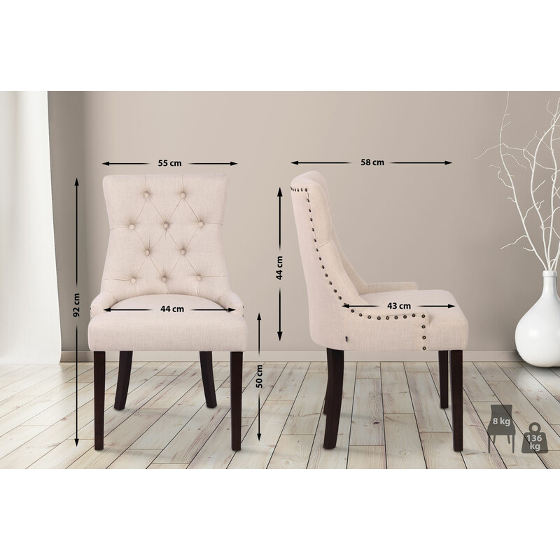 Elegant polstret spisestol med stof og dekorative syninger og fire gummitræben