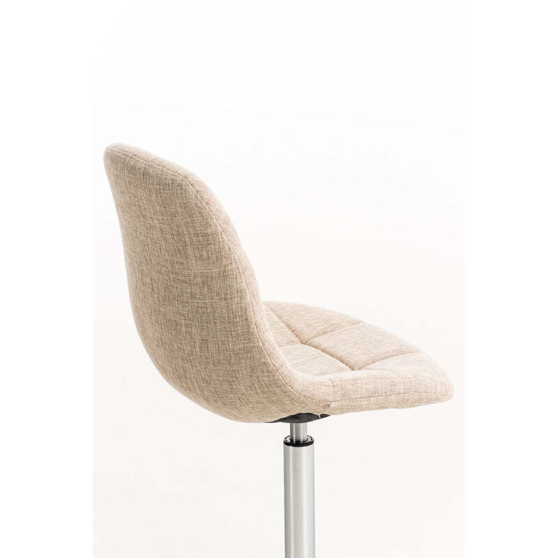 Roterende spisebordstol med polstret stofsæde kromramme og trompetben