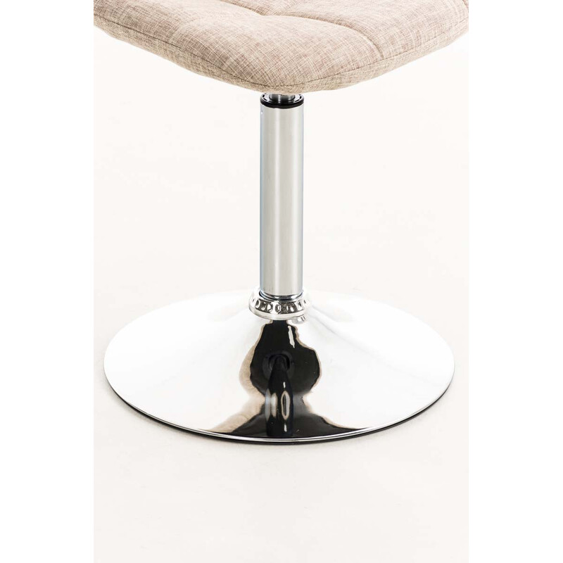 Roterende spisebordstol med polstret stofsæde kromramme og trompetben