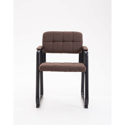 Elegant polstret besøgsstol med sort metalfod og tuftet sædebetræk