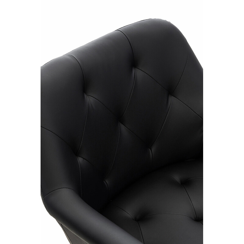 Moderne polstret spisestol med metalramme og armlæn i kunstlæder